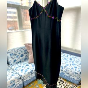 Gorgeous black spaghetti strap cocktail dress. Perfect for spring!